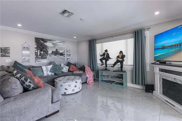 a living room with furniture a table and a painting