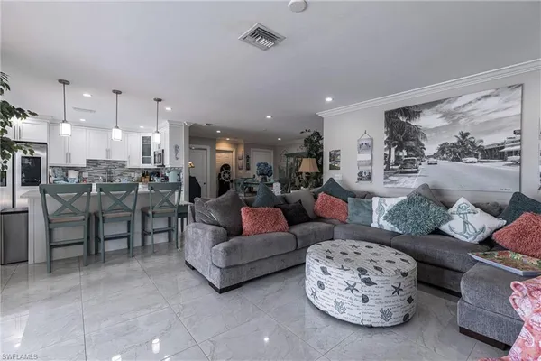 a dining area with a table and chairs