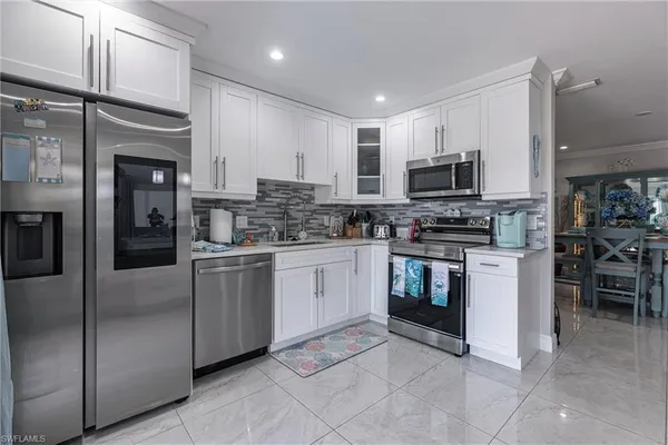 a large kitchen with cabinets