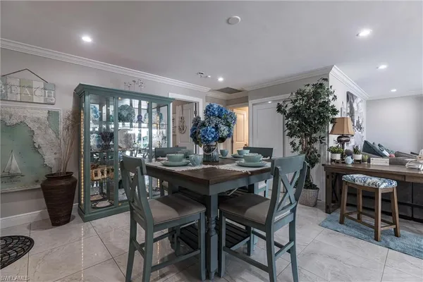 a kitchen with a table and chairs in it