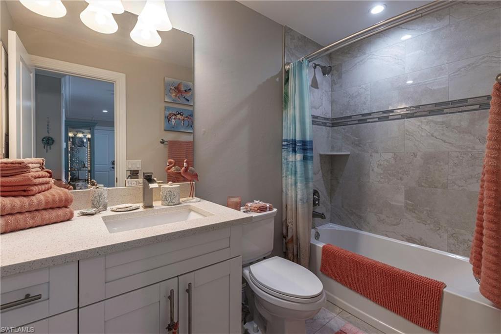 164 Trinidad Street Naples, FL 34113 - Photo 39 of 43 a bathroom with a sink a toilet and shower