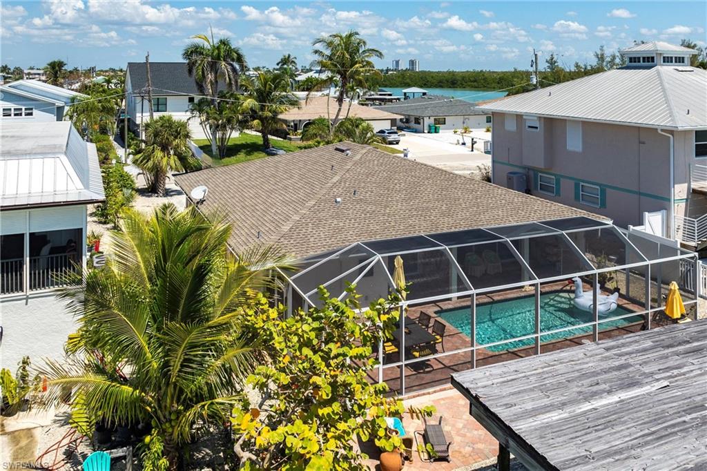 164 Trinidad Street Naples, FL 34113 - Photo 6 of 43 a terrace with outdoor seating and city view