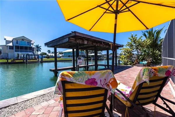 a view of swimming pool with outdoor seating space and swimming pool