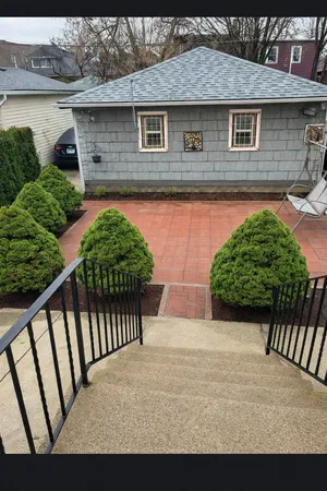a front view of a house with garden