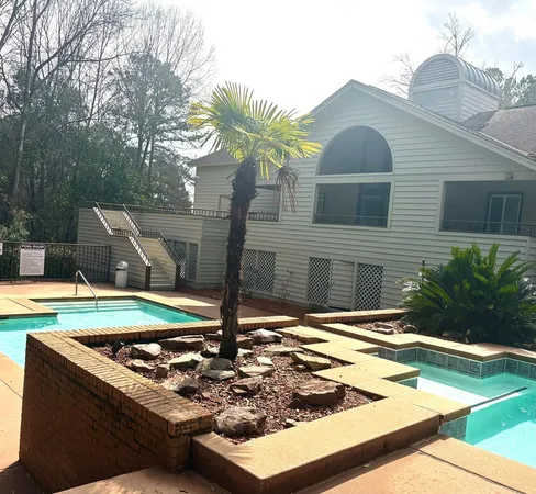 a view of a house with backyard