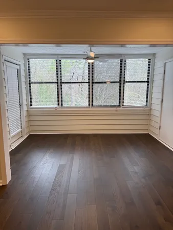 a view of lot of window and wooden floor
