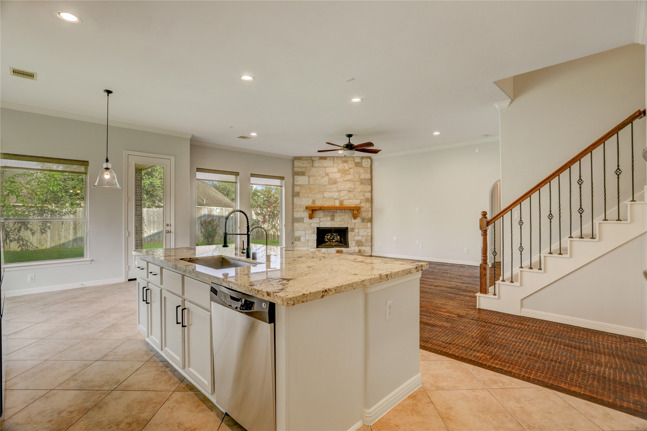 3002 Currant Drive Manvel, TX 77578 - Photo 12 of 43 a kitchen with stainless steel appliances granite countertop a sink and a stove