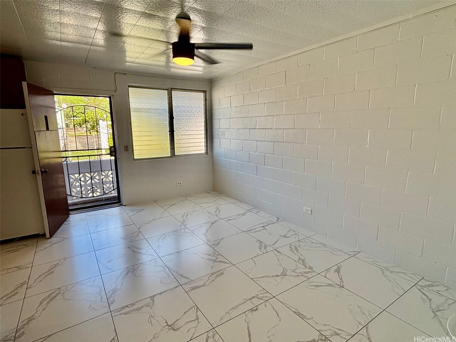 a view of an empty room and window