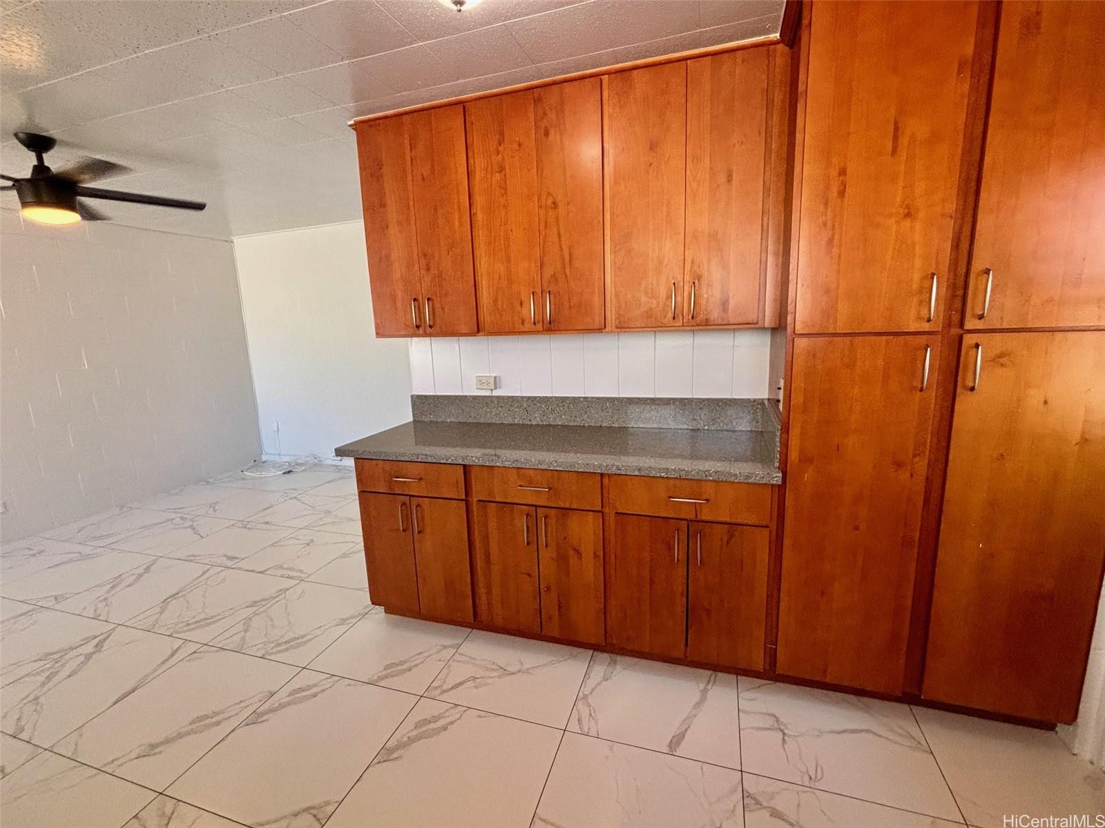 608 Judd Street, Unit A Honolulu, HI 96817 - Photo 3 of 13 a kitchen with a sink and cabinets