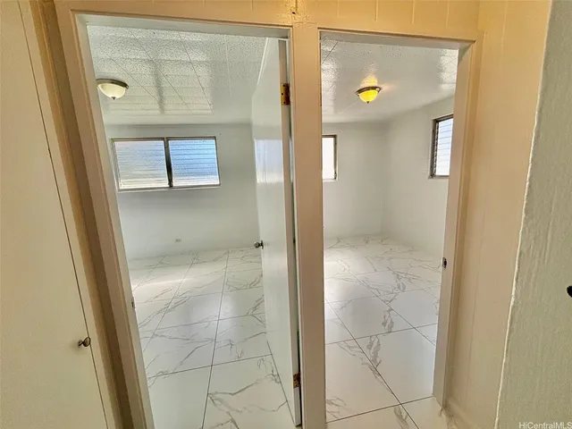 a bathroom with a granite countertop shower