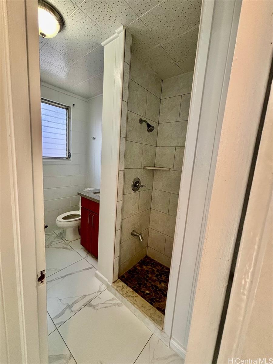 608 Judd Street, Unit A Honolulu, HI 96817 - Photo 8 of 13 a bathroom with a granite countertop shower