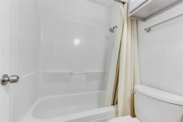 a close up of a bathtub curtain