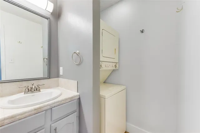 a bathroom with a sink and mirror