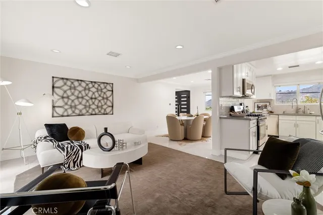 a kitchen with a table and chairs in it