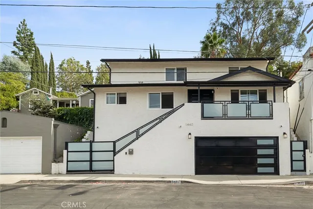 a front view of a house with a garage
