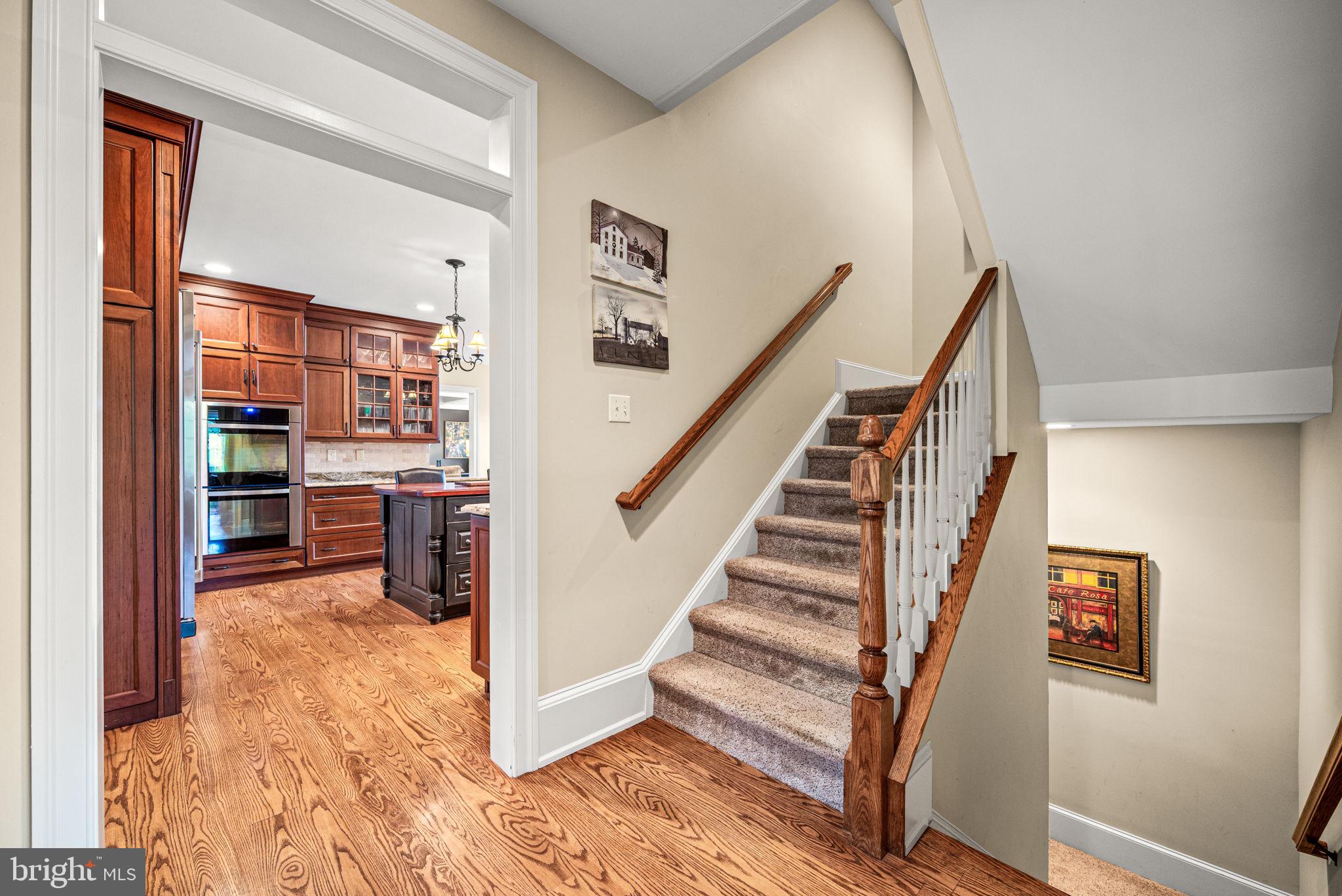 1548 Morstein Road Malvern, PA 19355 - Photo 30 of 80 a view of a hallway with wooden floor and staircase