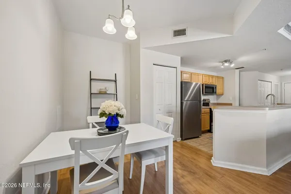 a kitchen with a stove a sink and a refrigerator