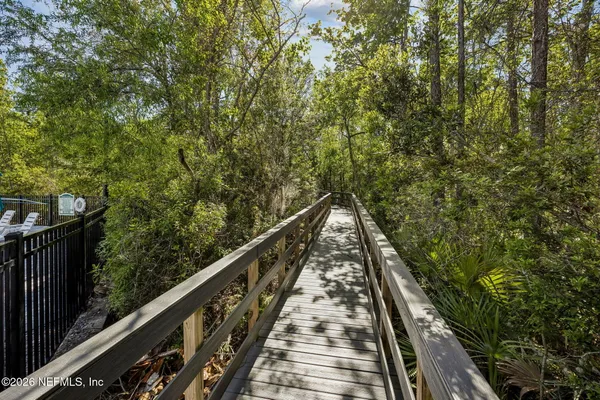 a view of a fire pit with large trees