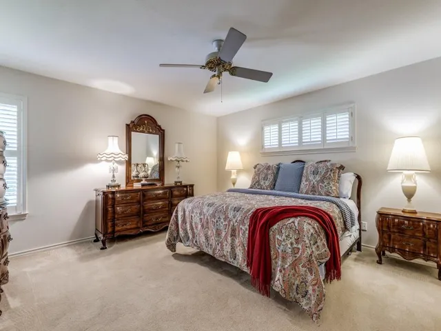 a bedroom with bed and window