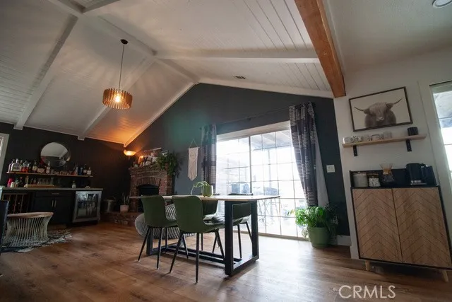 a view of a livingroom with workspace and a window