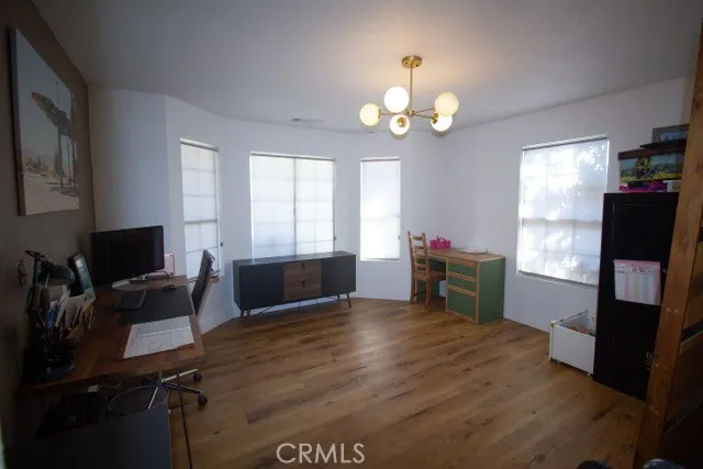 a view of a house with pool and sitting area