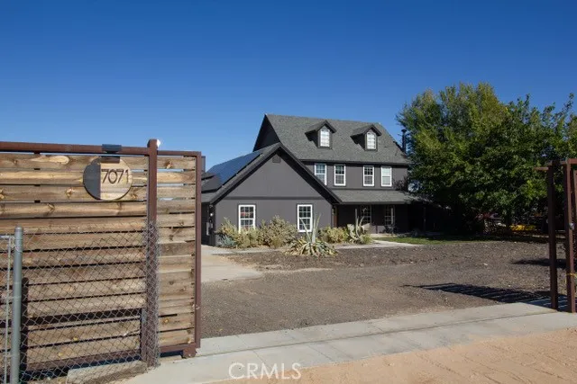 a view of a house with a backyard