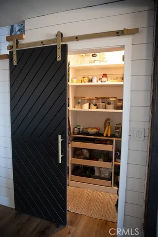 a shelf with books and knick knacks on it