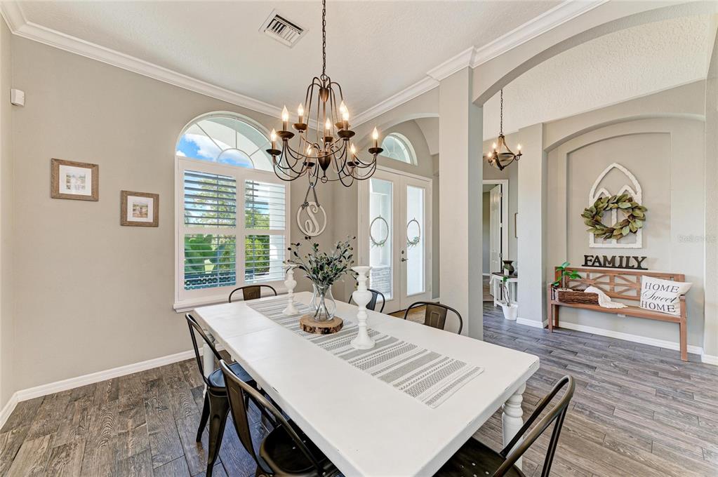 16336 26th Street East Parrish, FL 34219 - Photo 11 of 69 a view of a dining room with furniture window and wooden floor