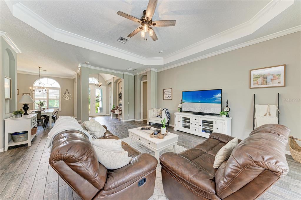 16336 26th Street East Parrish, FL 34219 - Photo 18 of 69 a living room with furniture a flat screen tv and a large window