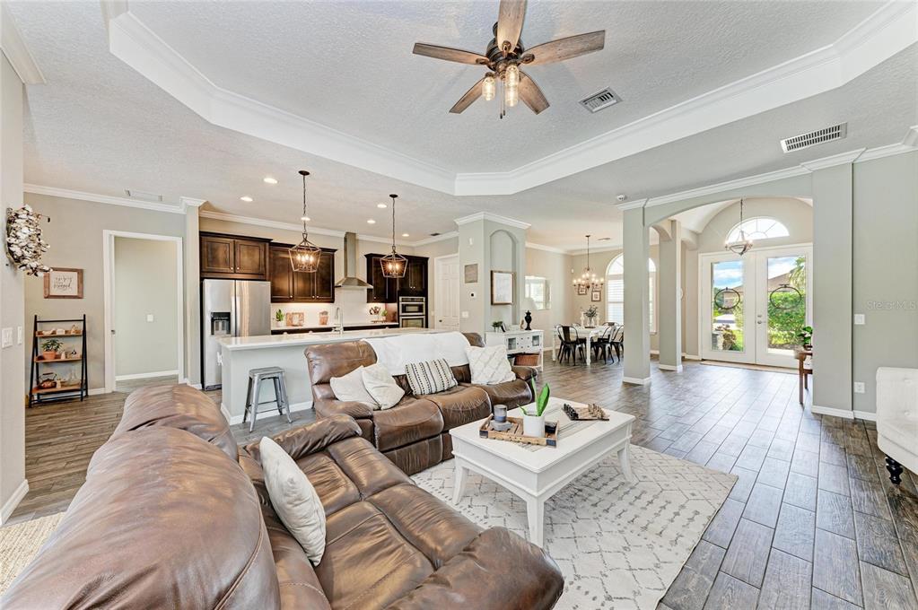 16336 26th Street East Parrish, FL 34219 - Photo 19 of 69 a living room with furniture and kitchen view