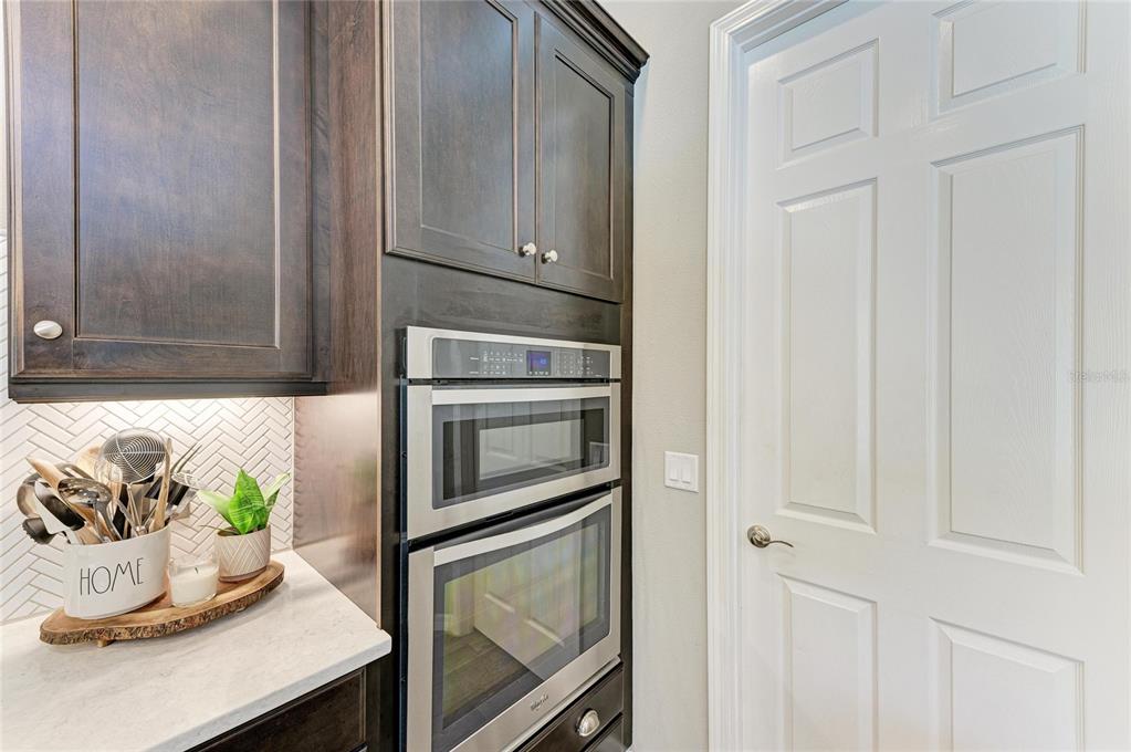 16336 26th Street East Parrish, FL 34219 - Photo 25 of 69 a kitchen with a stove and cabinets