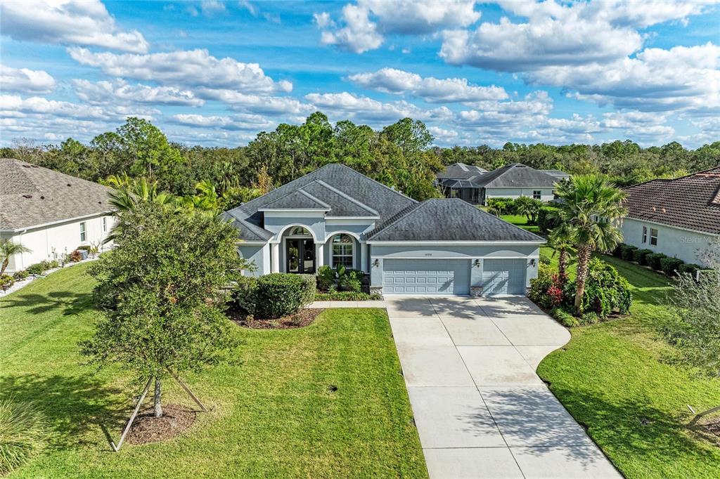 16336 26th Street East Parrish, FL 34219 - Photo 3 of 69 a front view of a house with yard