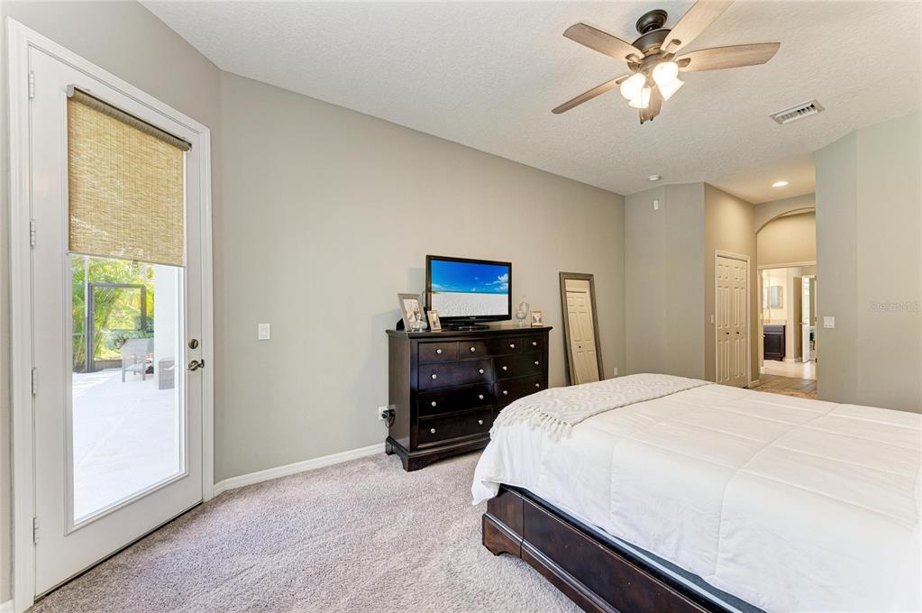 16336 26th Street East Parrish, FL 34219 - Photo 32 of 69 a bedroom with a bed and a flat screen tv