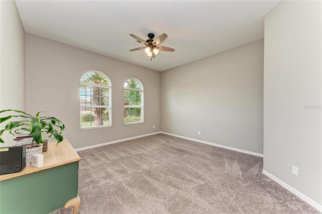 16336 26th Street East Parrish, FL 34219 - Photo 39 of 69 an empty room with windows and flower pot