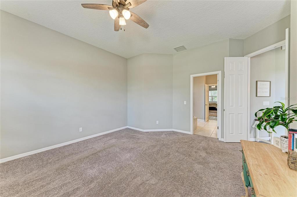 16336 26th Street East Parrish, FL 34219 - Photo 40 of 69 a view of an empty room with a chandelier fan