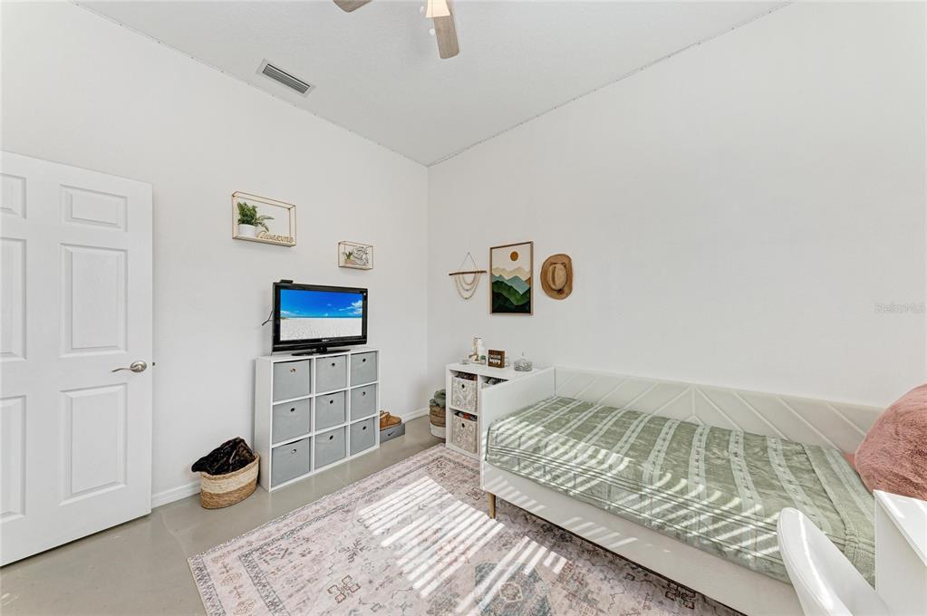 16336 26th Street East Parrish, FL 34219 - Photo 44 of 69 a bedroom with a bed and a window