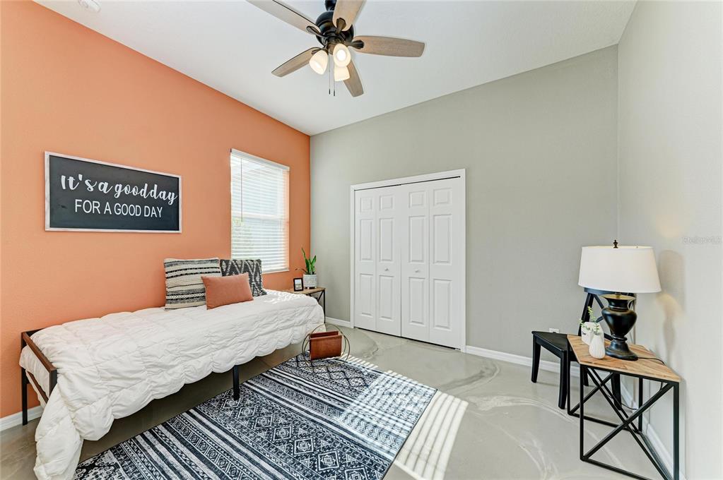16336 26th Street East Parrish, FL 34219 - Photo 46 of 69 a bedroom with a bed and a table in it