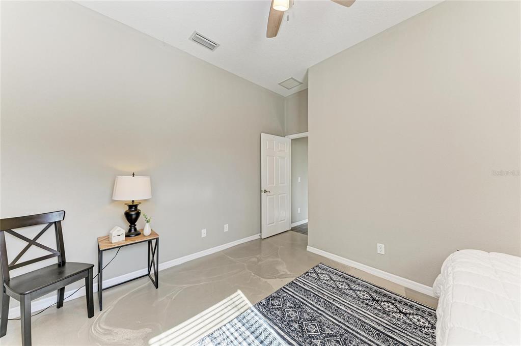16336 26th Street East Parrish, FL 34219 - Photo 47 of 69 a view of a livingroom with a couch and a dresser with wooden floor