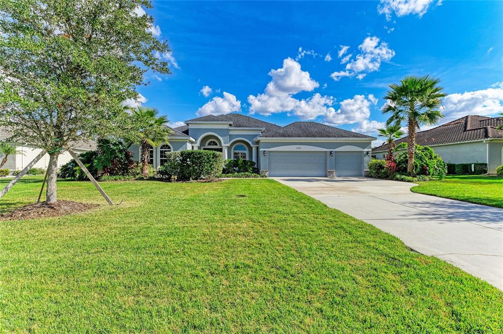 16336 26th Street East Parrish, FL 34219 - Photo 6 of 69 a front view of a house with a yard