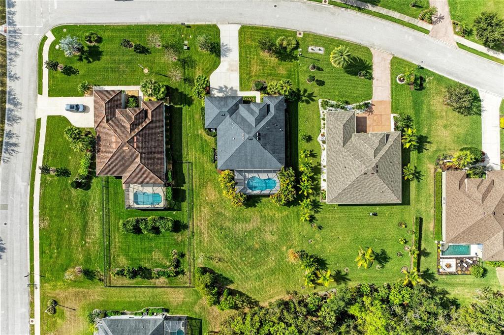 16336 26th Street East Parrish, FL 34219 - Photo 61 of 69 an aerial view of residential houses with outdoor space and trees
