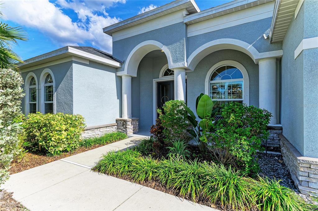 16336 26th Street East Parrish, FL 34219 - Photo 8 of 69 a front view of a house with garden