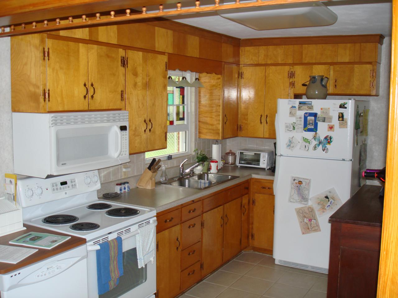 231 Poplar Drive Blue Ridge, VA 24064 - Photo 5 of 6 a kitchen with a refrigerator and a stove