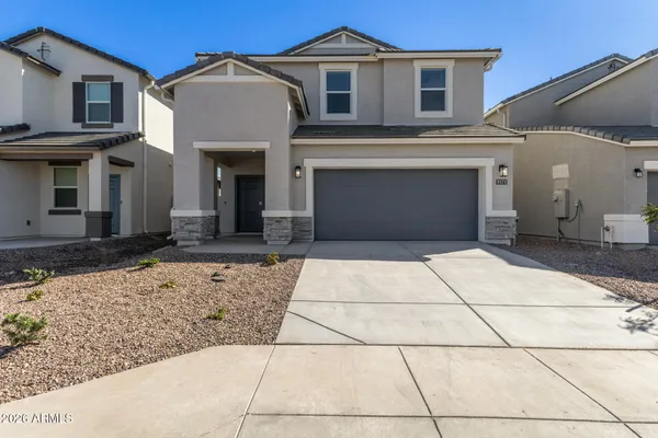 a front view of a house with a garage