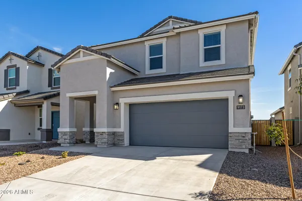 a front view of a house with a garage