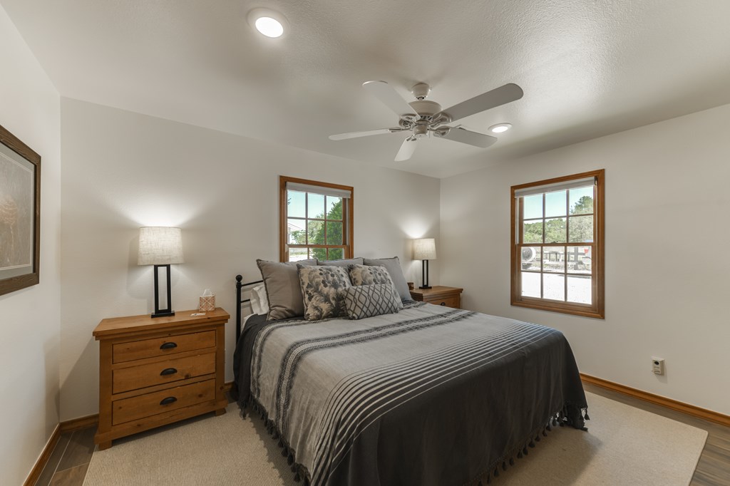 0 County Road Evant, TX 76525 - Photo 40 of 41 a bedroom with a bed and a chandelier
