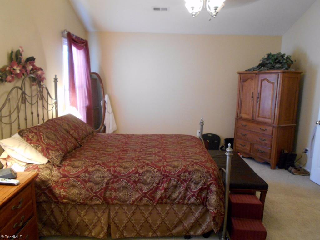 4301 Shade Tree Court High Point, NC 27265 - Photo 13 of 23 Master bedroom is very large with dual closets and an en-suite bath/spa