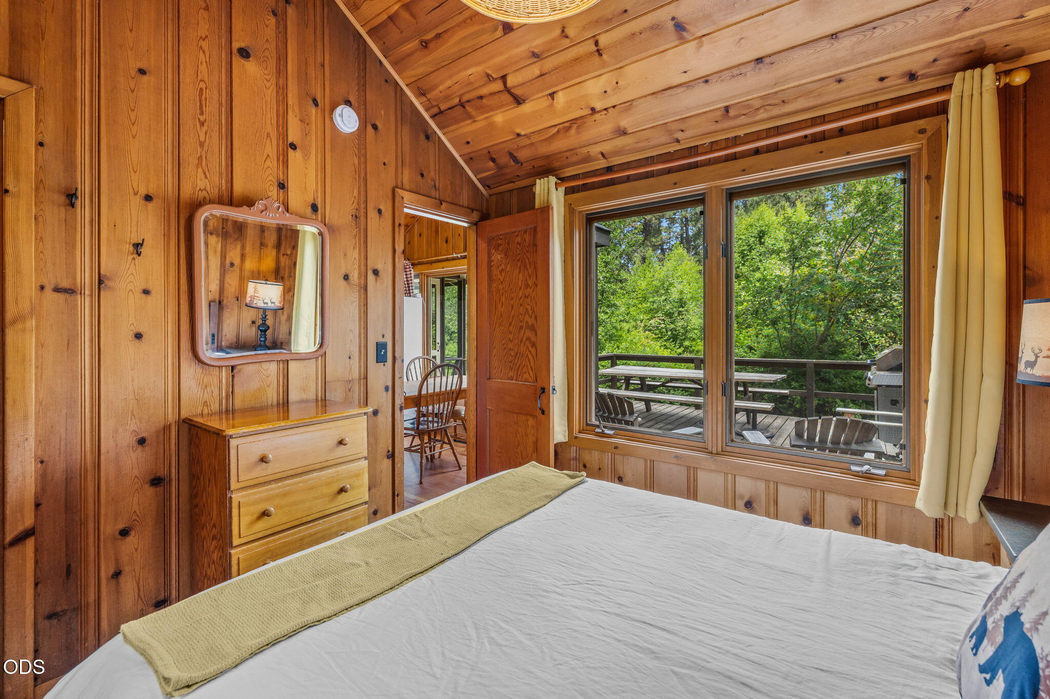 13375 Southwest Forest Service Road, Unit 3 U1 Camp Sherman, OR 97730 - Photo 15 of 29 a bedroom with a bed and large windows