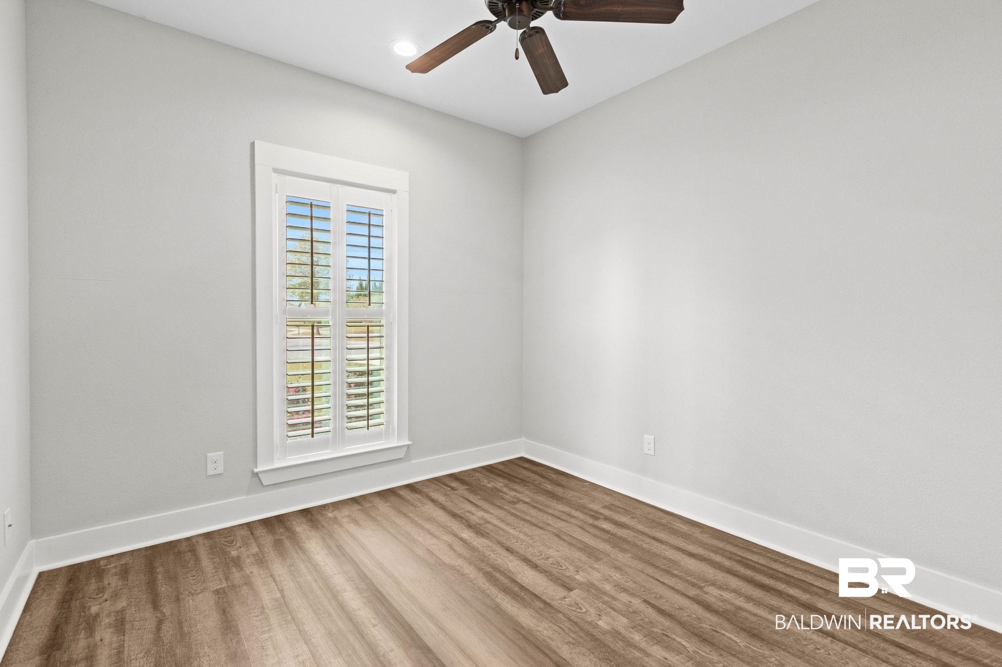 17376 Bankhead Boulevard Fairhope, AL 36532 - Photo 48 of 73 Unfurnished room with wood finished floors and ceiling fan