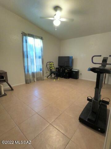 13643 East Bright Sky Loop Vail, AZ 85641 - Photo 9 of 22 a room with gym equipment and a flat screen tv