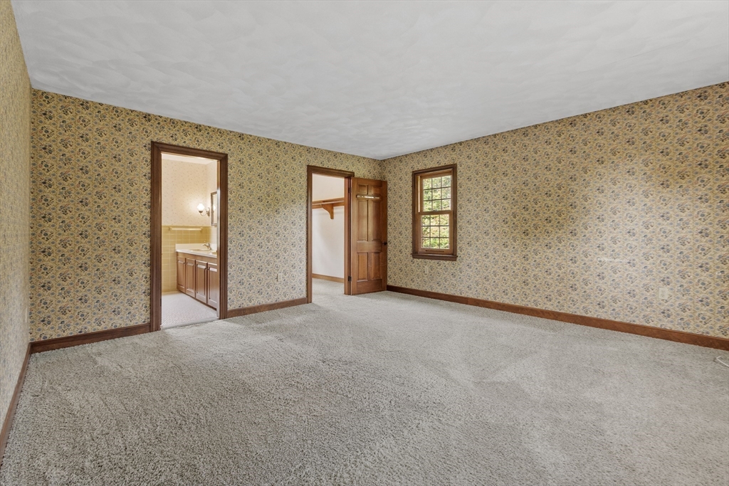 286 Old Bay Road Bolton, MA 01740 - Photo 23 of 37 an empty room with windows and closet